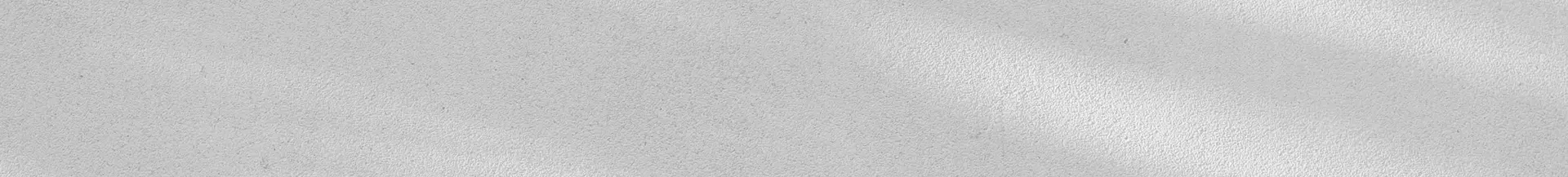 A textured surface with a subtle pattern of light and shadow. The color is light grey, giving it a soft, neutral appearance.